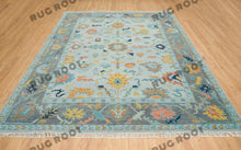 Load image into Gallery viewer, City Skyline Silhouette | Handwoven Oushak Rug | Light Blue with Pops of Color