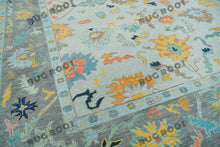 Load image into Gallery viewer, City Skyline Silhouette | Handwoven Oushak Rug | Light Blue with Pops of Color