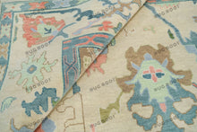 Load image into Gallery viewer, Serene Slumber Sand Oushak Rug with Coral, Green, and Pale Blue Accents