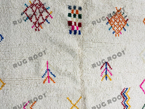 Handcrafted Moroccan Azilal Rug | Whimsical Wool Tapestry in Ivory with Rainbow Accents