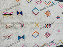 Load image into Gallery viewer, Handcrafted Moroccan Azilal Rug | Whimsical Wool Tapestry in Ivory with Rainbow Accents

