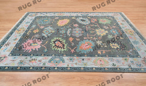 Midnight Garden | Handwoven Dark Grey & Blue Oushak Rug with Pink & Green Accents | Wool, Bedroom